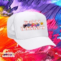 a white trucker hat with colorful paint on it